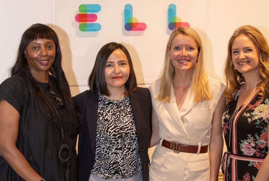 Four female-identifying people (Chiwoniso Kaitano, Xanthe Scharff, Zahra Nader, and Jane Ferguson) pose for a portrait under the MacDowell logo.