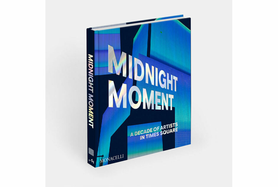 A photo of the book "Midnight Moment: A Decade of Artists in Times Square", featuring an abstract-geometric blue cover design.