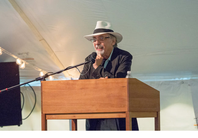 Medalist Art Spiegelman speaks at a podium on the Medal Day stage