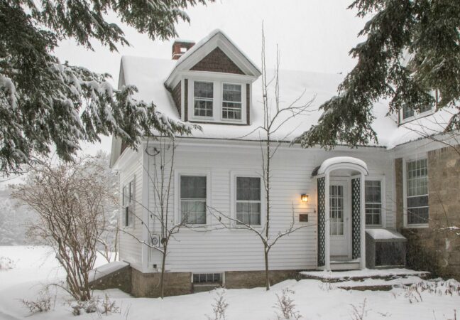 Heyward studio in winter. The building and surrounding scene is shrouded in snow.