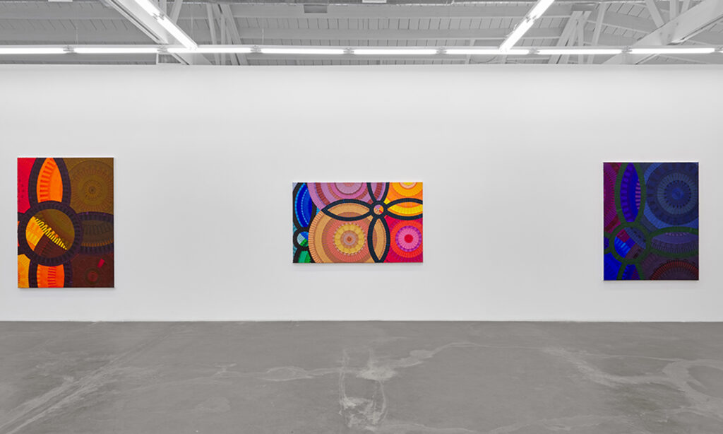 June Edmonds Meditations on African Resilience installation view, three large colorful paintings on a wall in a gallery